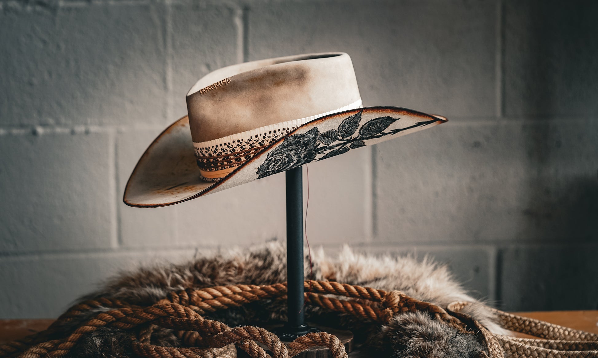 custom cowboy hat in sand with black rose painting